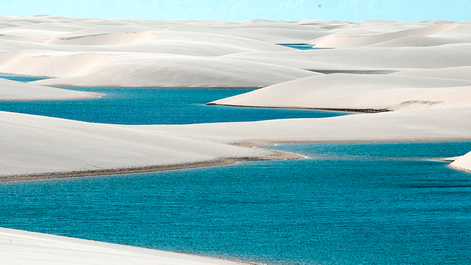 A large body of water in the middle of a desert.