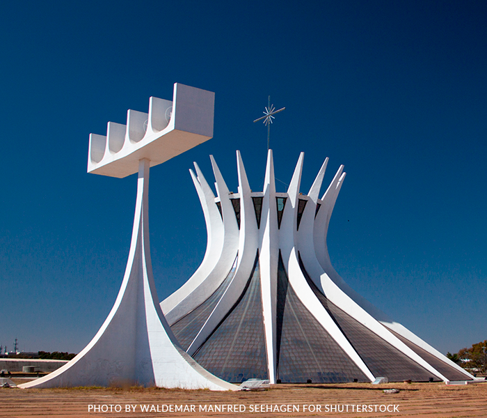 A large white building with a blue sky in the background