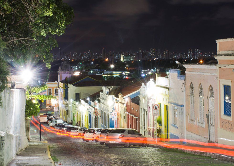 A long exposure photo of a city street at night