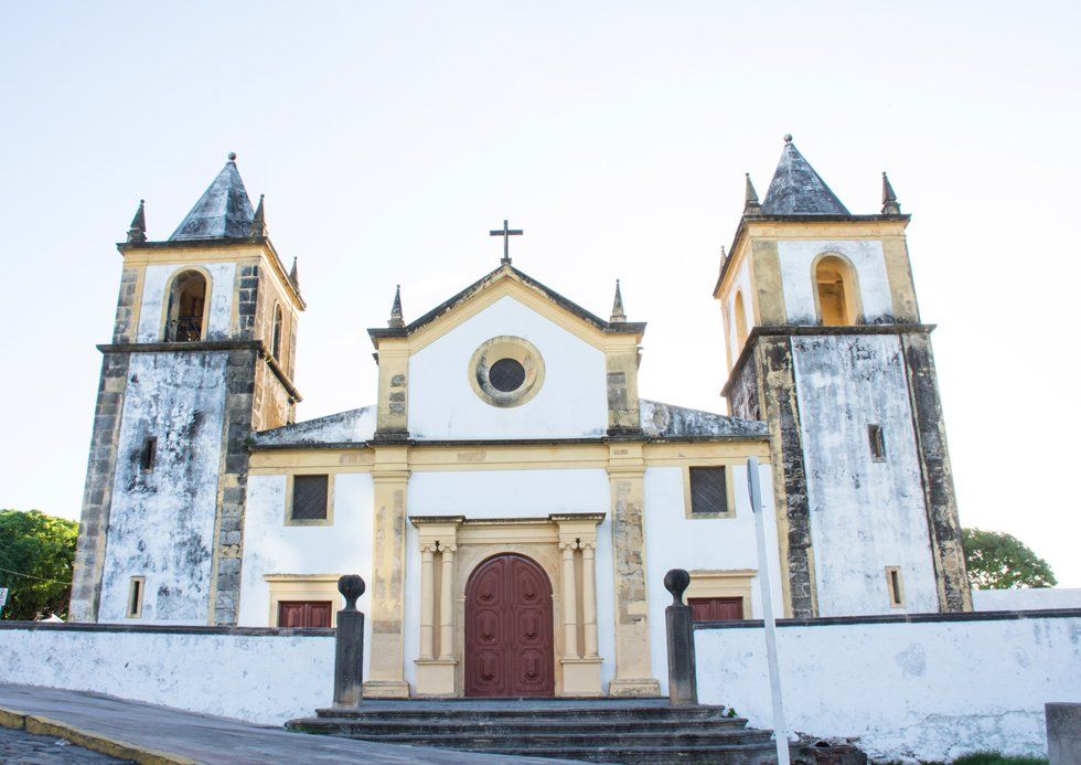 A church with two towers and a cross on top
