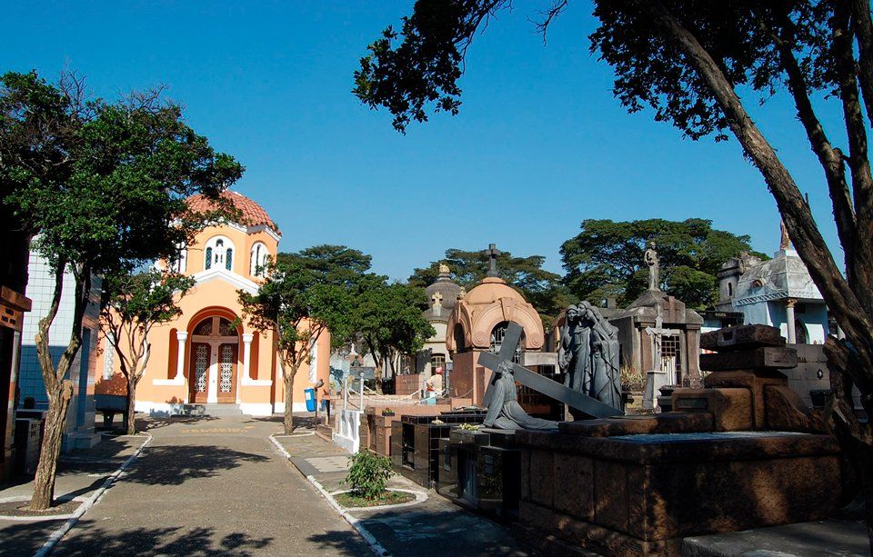 A cemetery with a church in the background