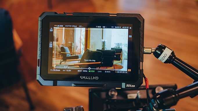 A camera is taking a picture of a living room.