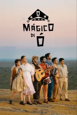 A group of people are standing on top of a hill.