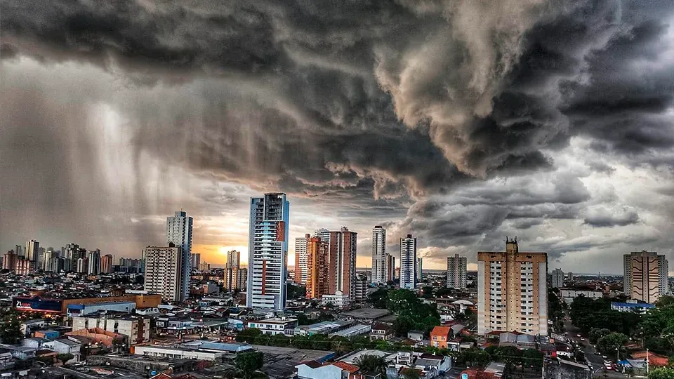 Panoramic view of Belém's skyline with a storm forming up above.