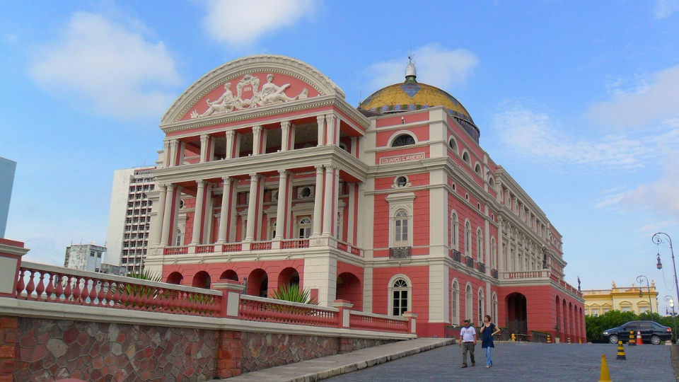 A large red and white building with a dome on top of it.
