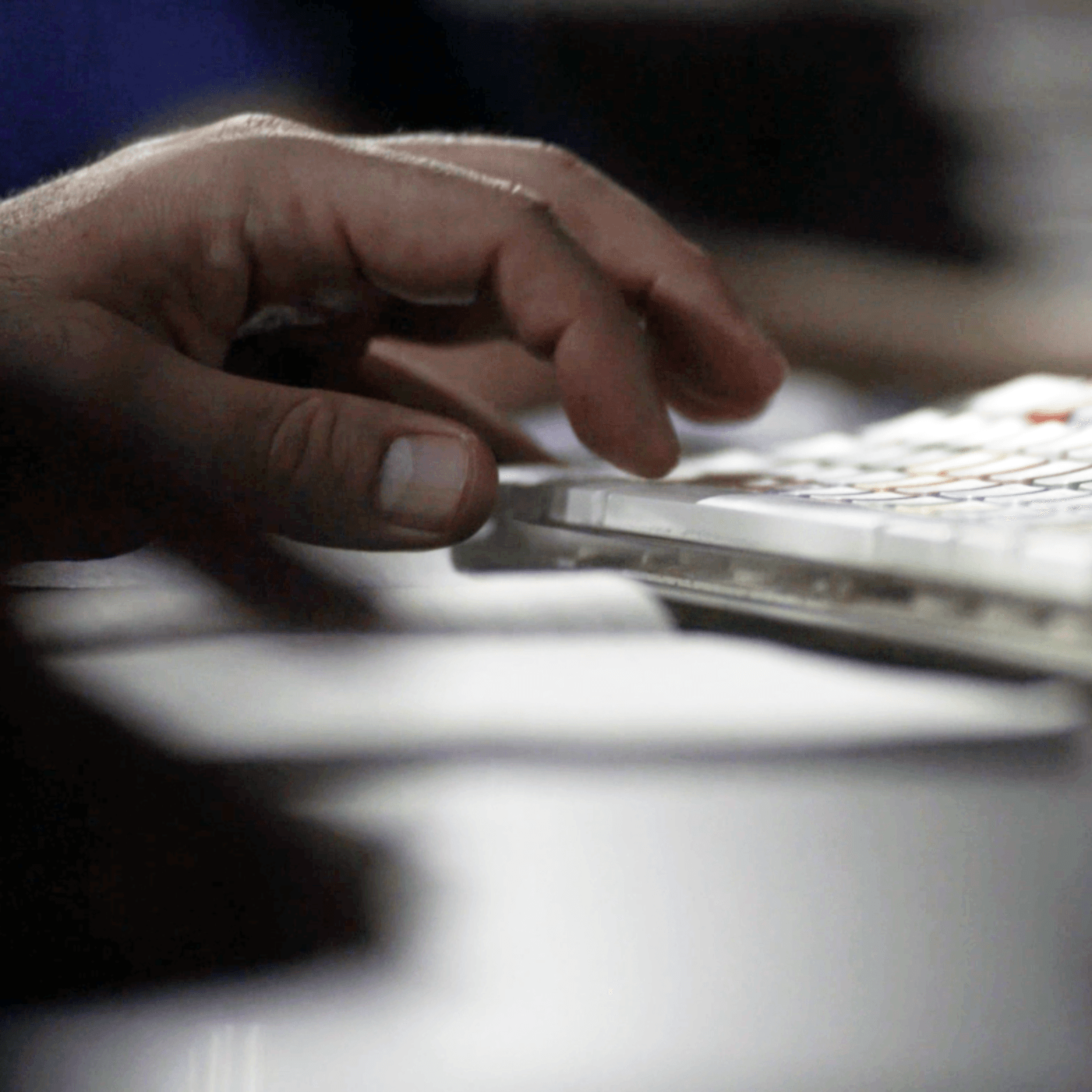Remote post-production A close up of a person 's hand typing on a keyboard