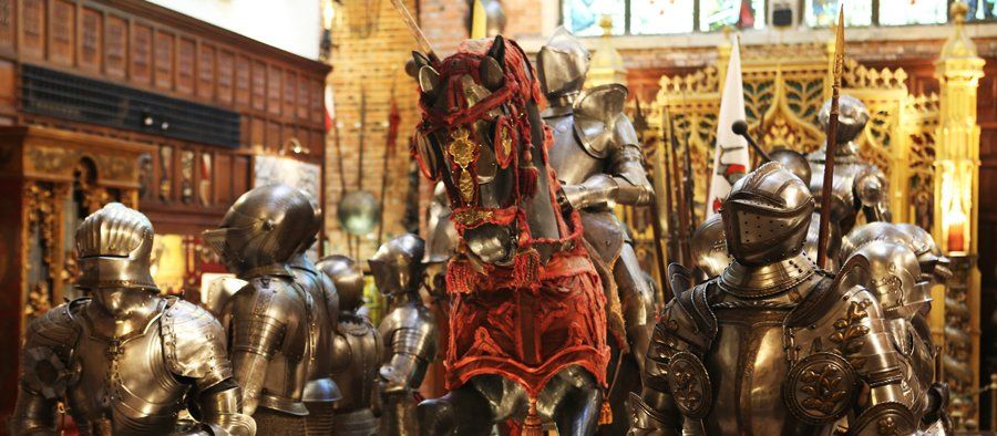 Ricardo Brennand Institute A group of knights in armor are standing around a horse.