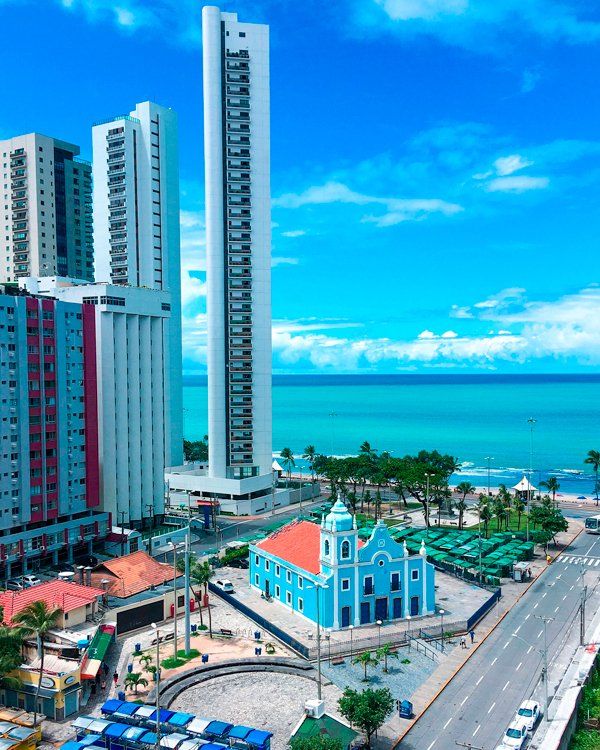 Pracinha de Boa Viagem in Recife An aerial view of a city with a church in the middle