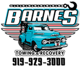 The logo for barnes towing and recovery shows a blue truck with a crane on top of it.