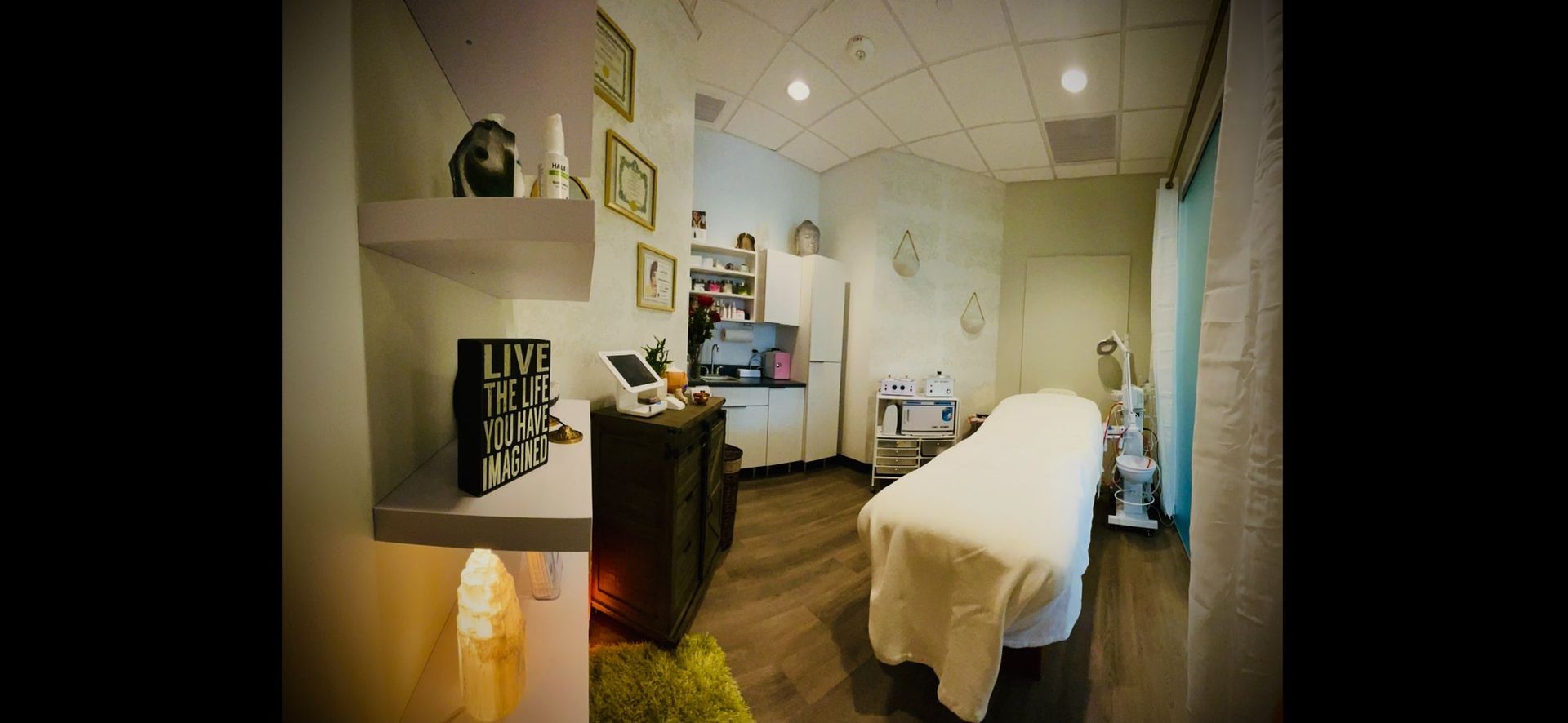 There is a massage table in the middle of the room.