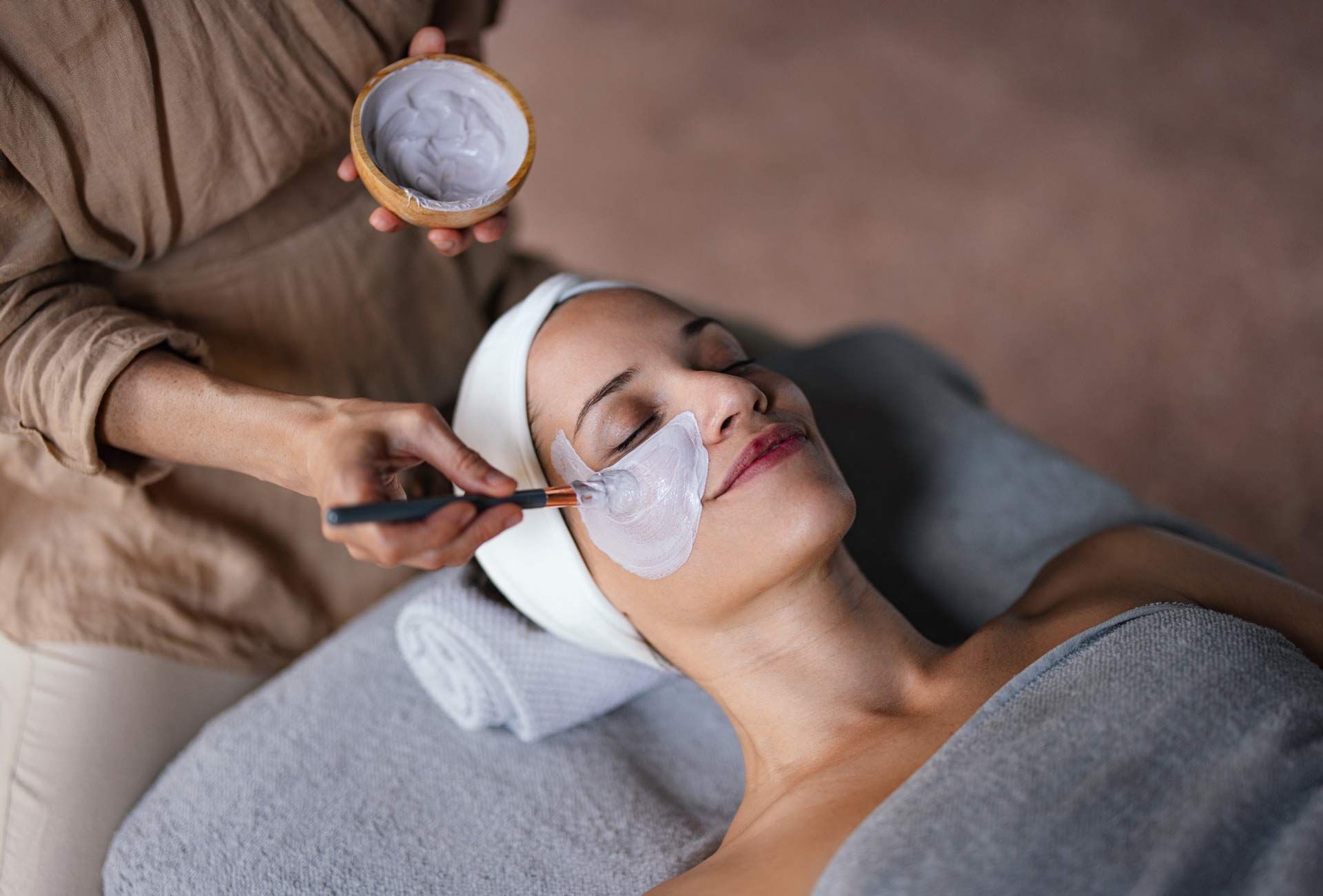 A woman is getting a facial treatment at a spa — Kennett Square, PA — Mystical Beauty Studio