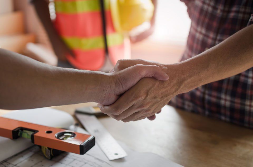 Contractor Handshake with Client | Green Bay, WI | Machkovich Roofing LLC