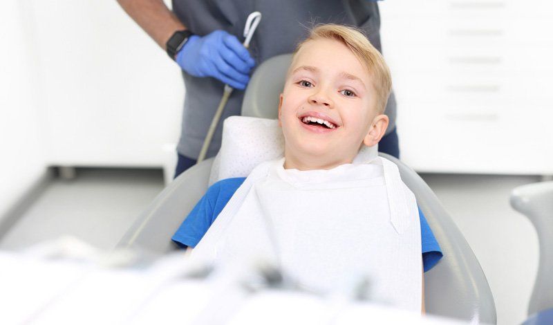 Boy Smiling During Dental Checkup — Bismarck, ND — A Lifetime of Smiles
