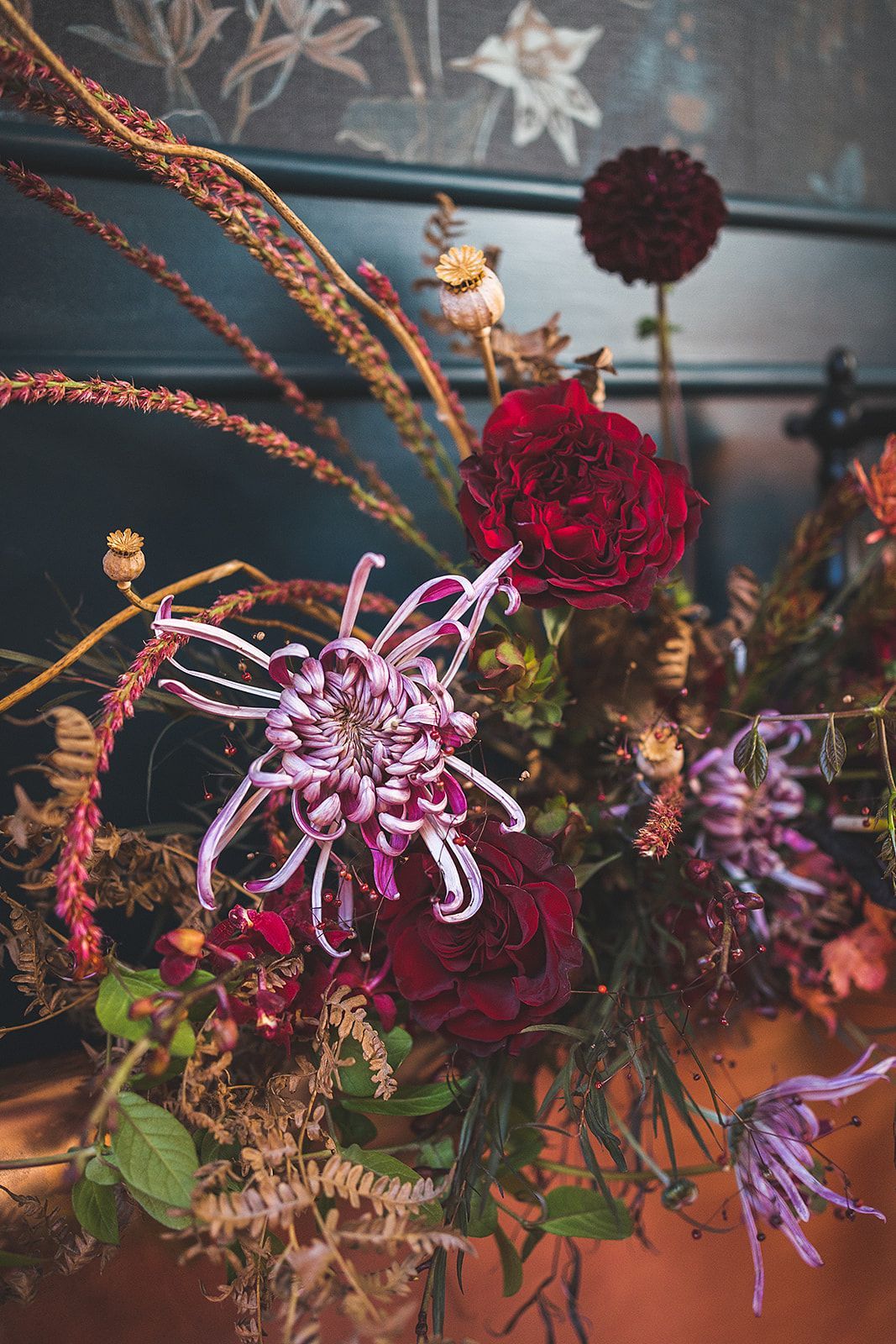 A close up of a bouquet of flowers on a table.