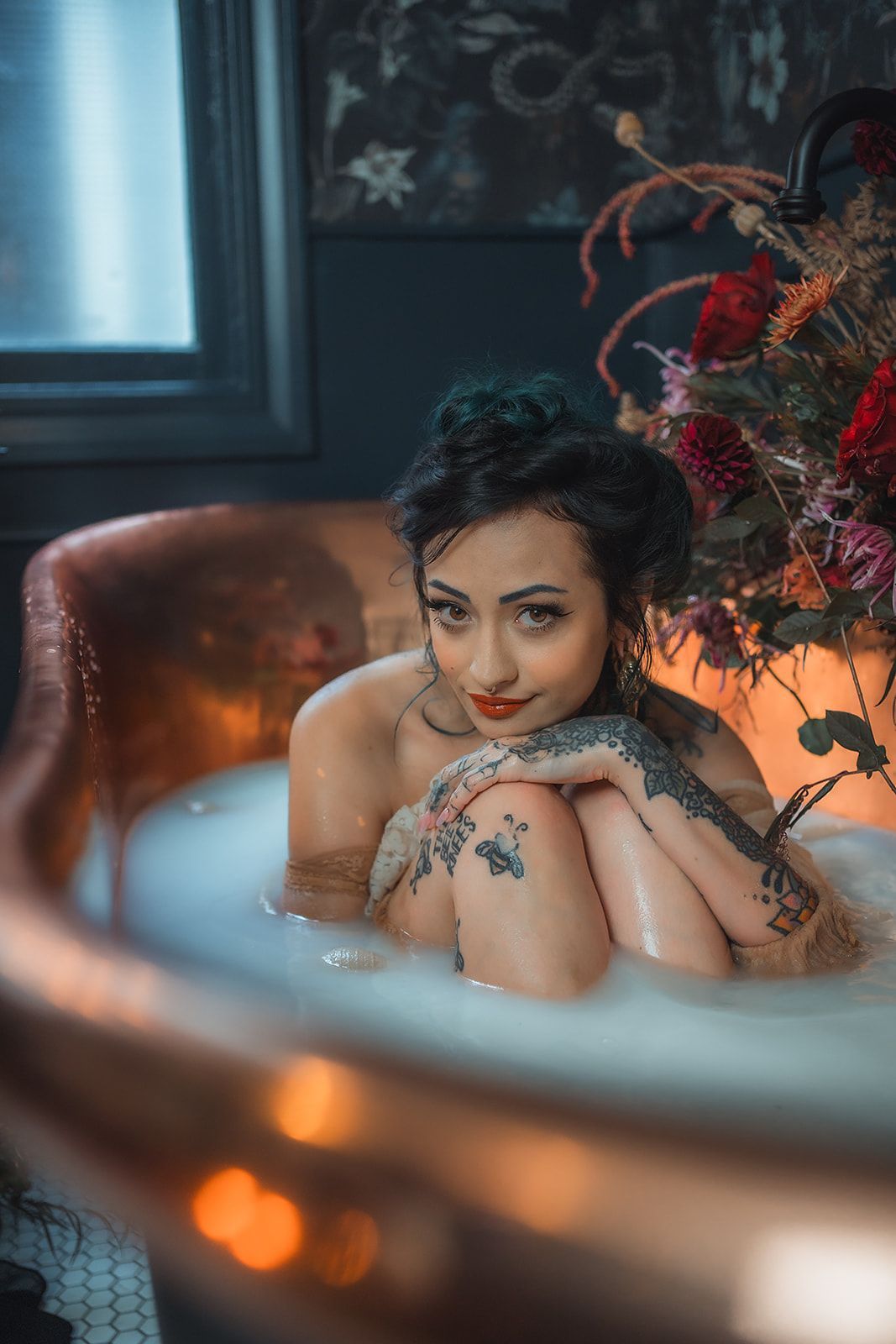 A woman is taking a milk bath for a photoshoot in Medford, Oregon 