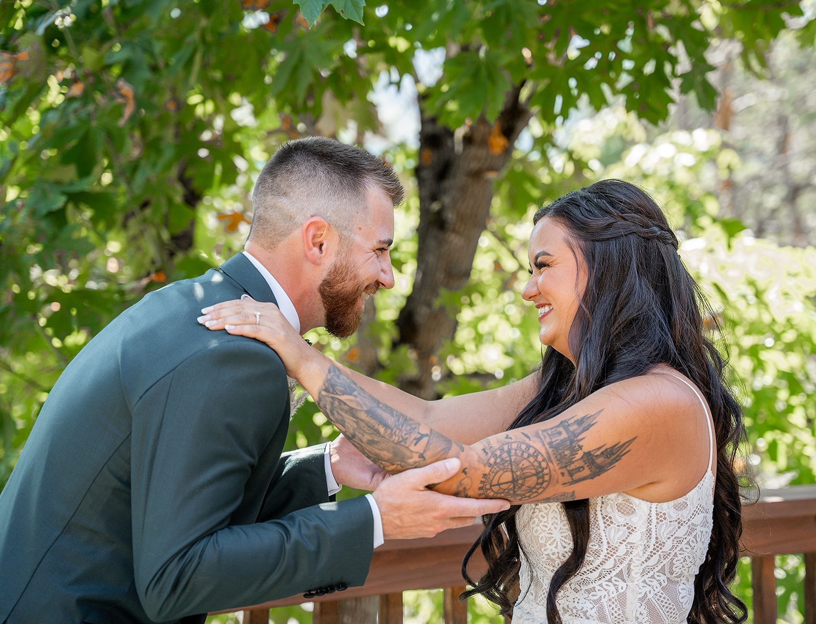 A bride and groom are looking at each other on their wedding day.