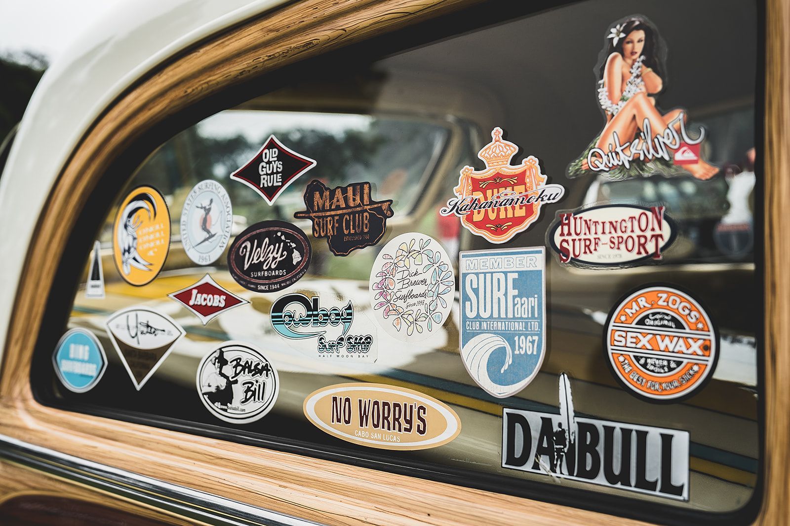 A car with a lot of stickers on the window.