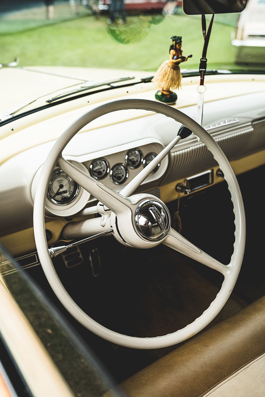 A close up of a steering wheel in a car