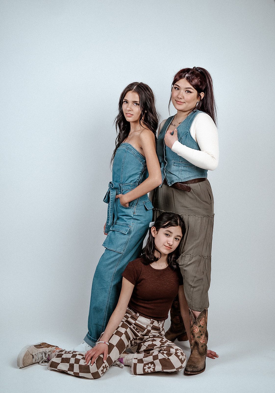 Three women are posing for a picture together.