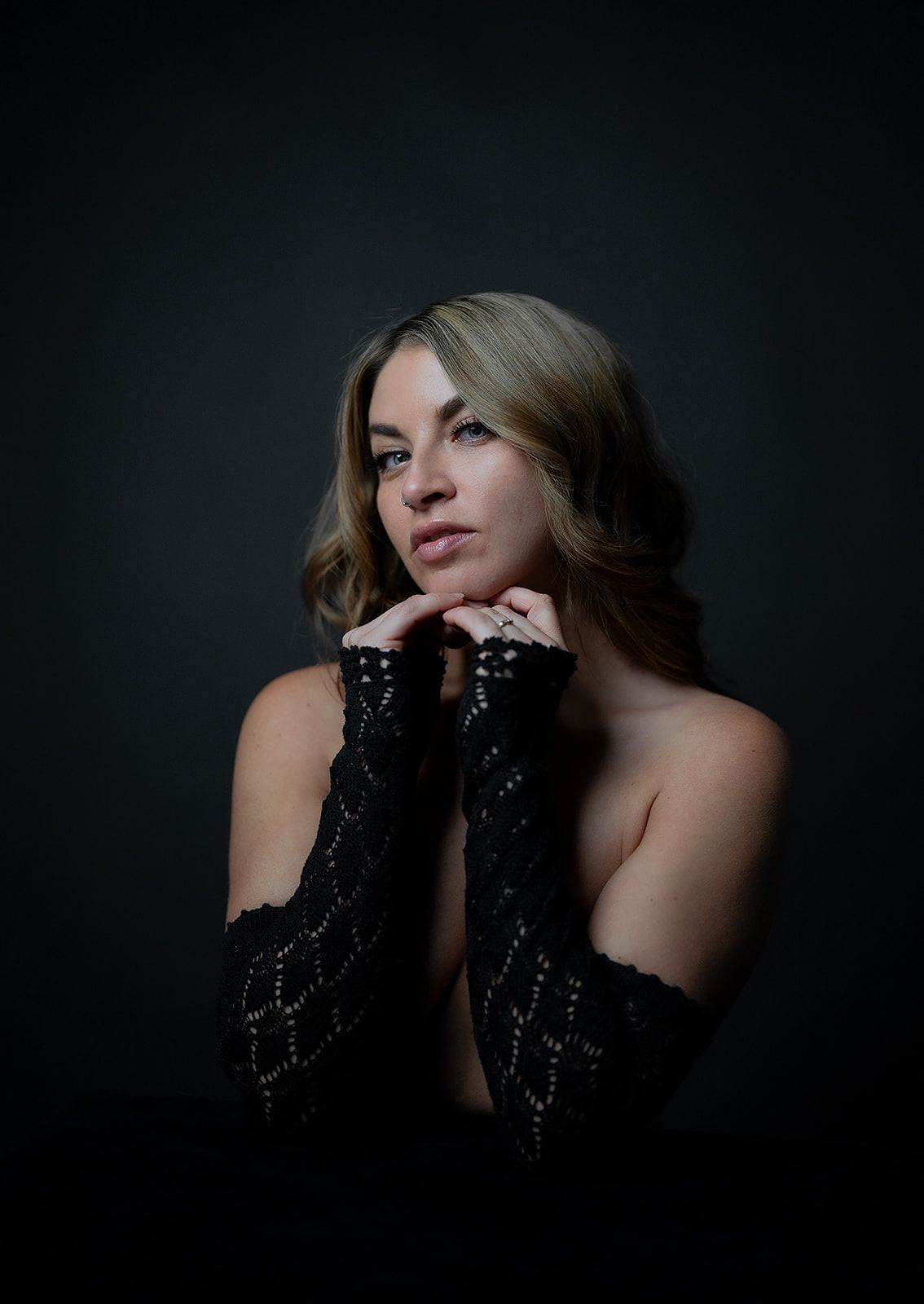 A woman posing for a boudoir photo session in Medford, Oregon