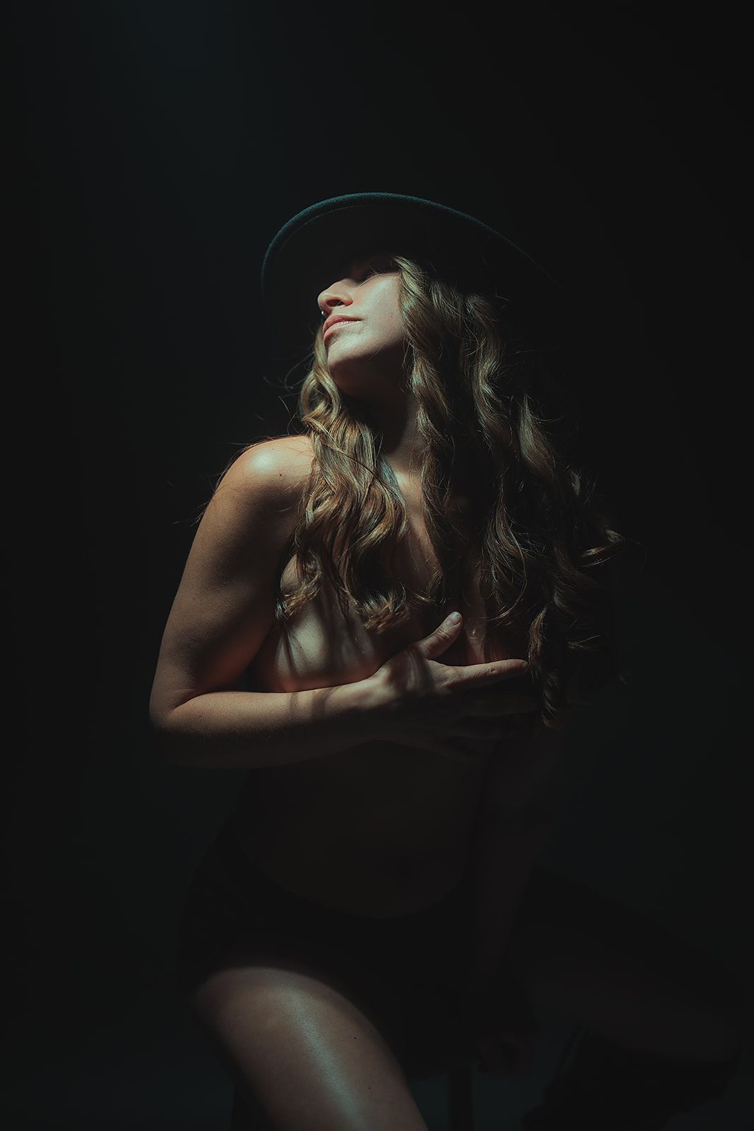 A woman posing for a boudoir photo session in Medford, Oregon