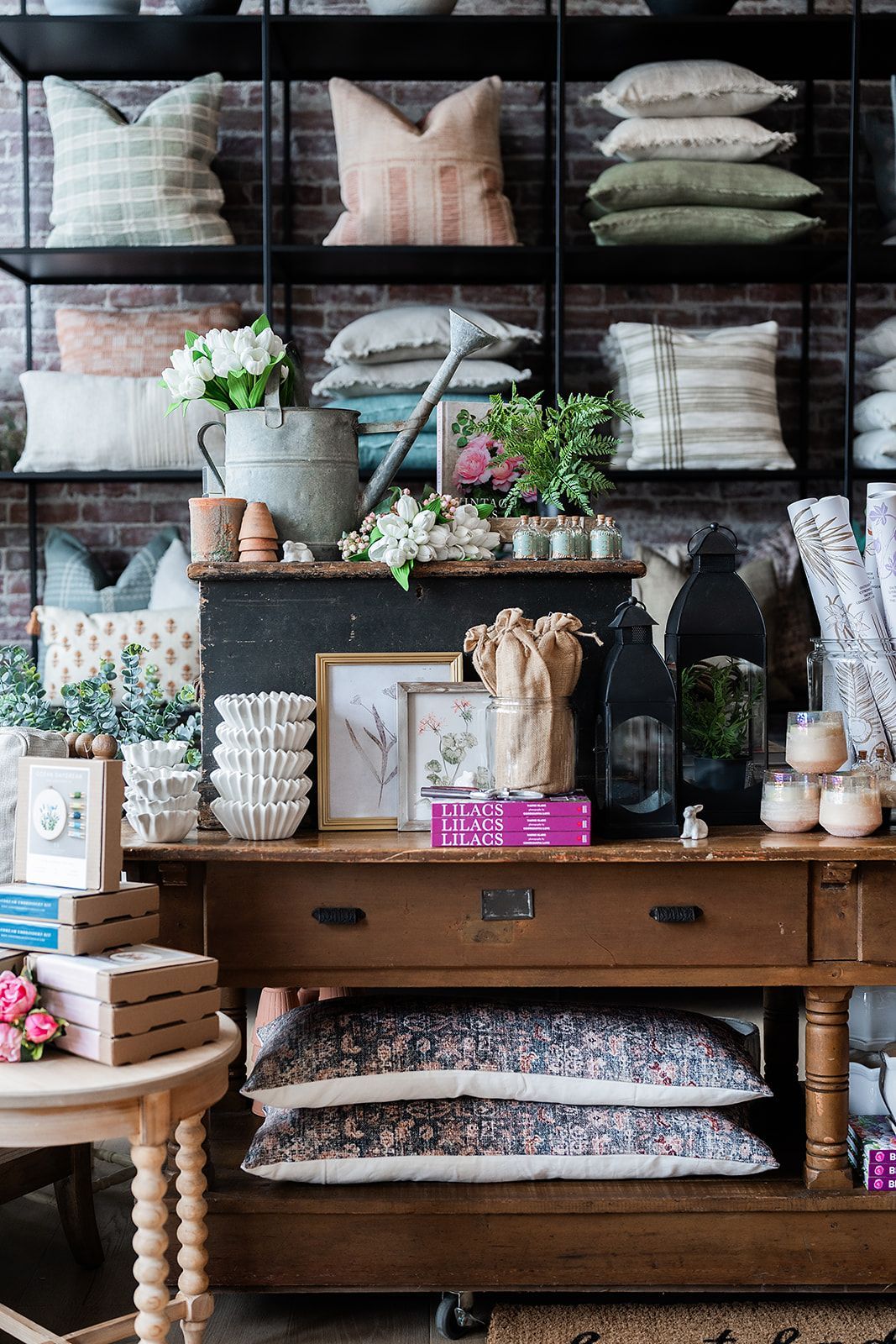 A store filled with lots of pillows and candles.