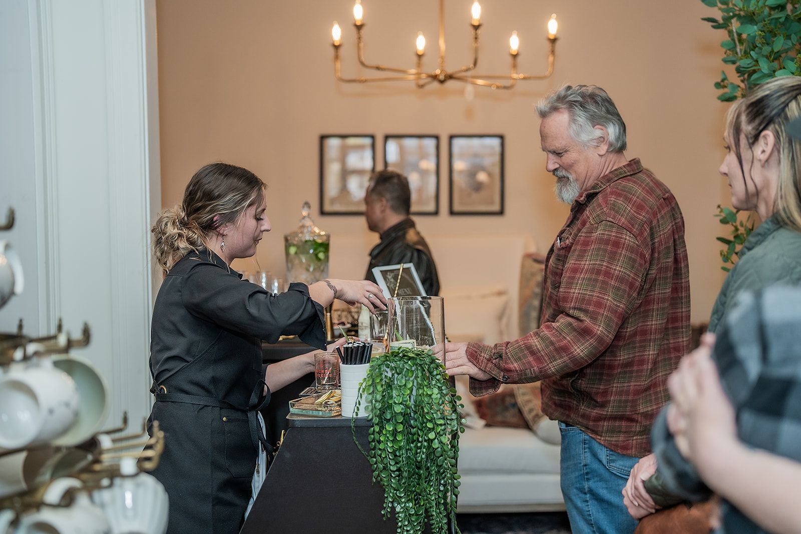 A man and a woman are standing next to each other in a living room.