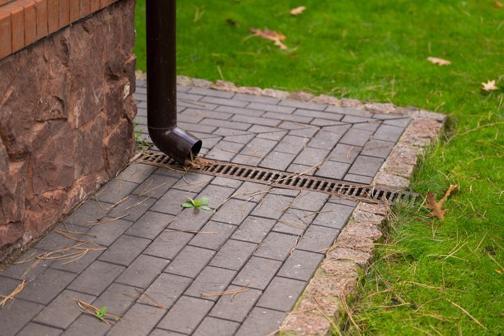 How Integrated Hardscaping and Drainage Systems Improve Property Value and Prevent Damage