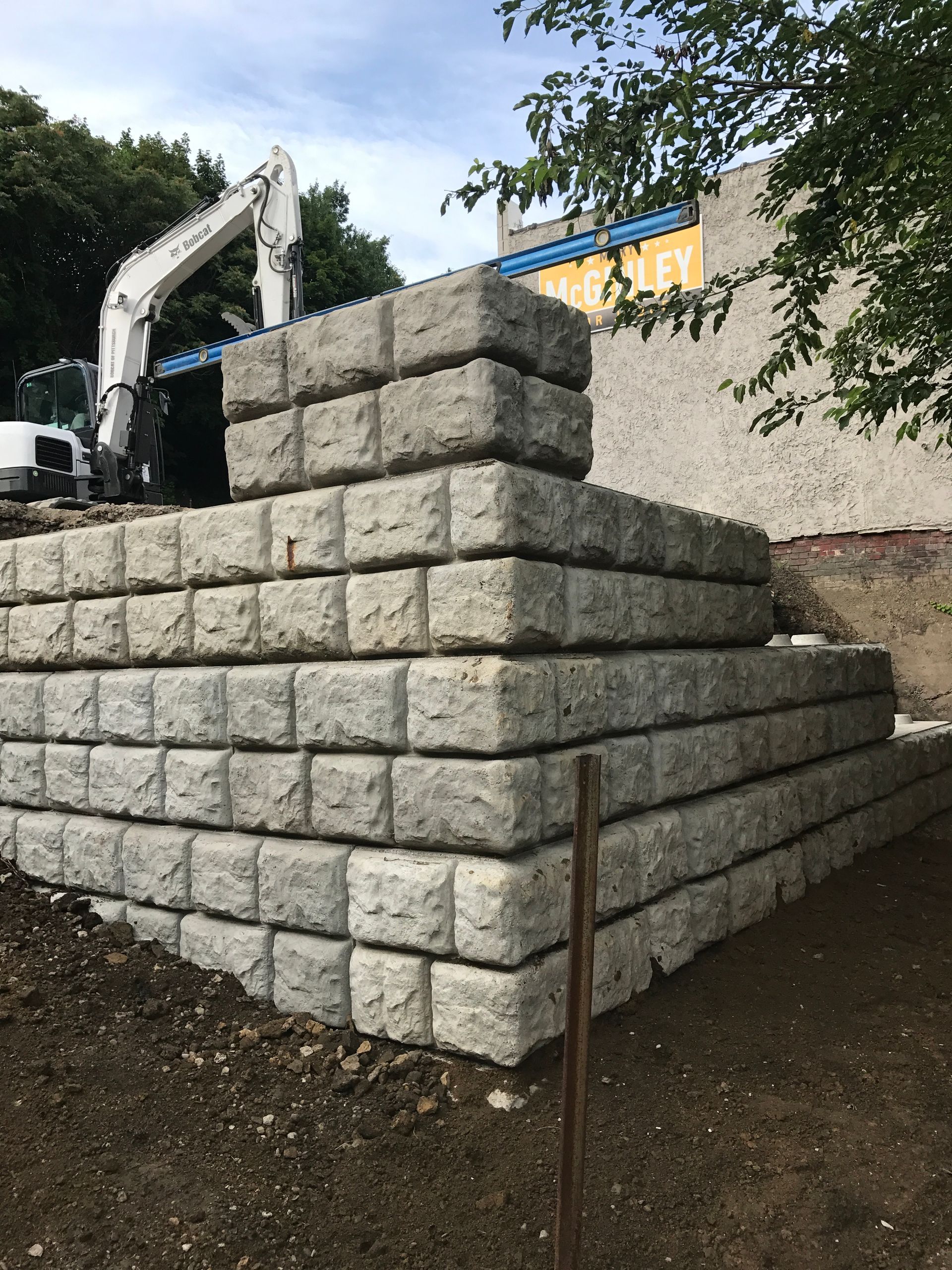 A stack of concrete blocks sitting on top of each other on a construction site.