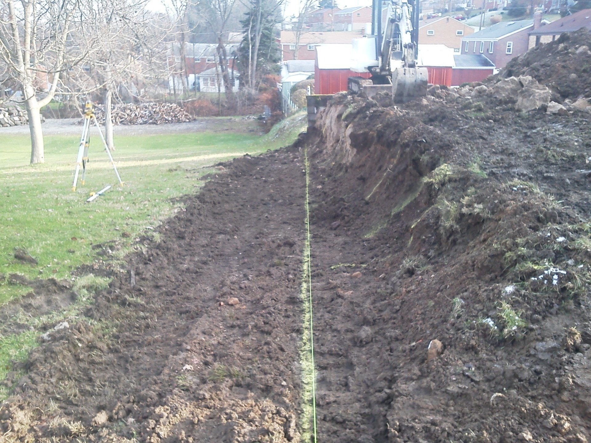 A large pile of dirt with a yellow line going through it