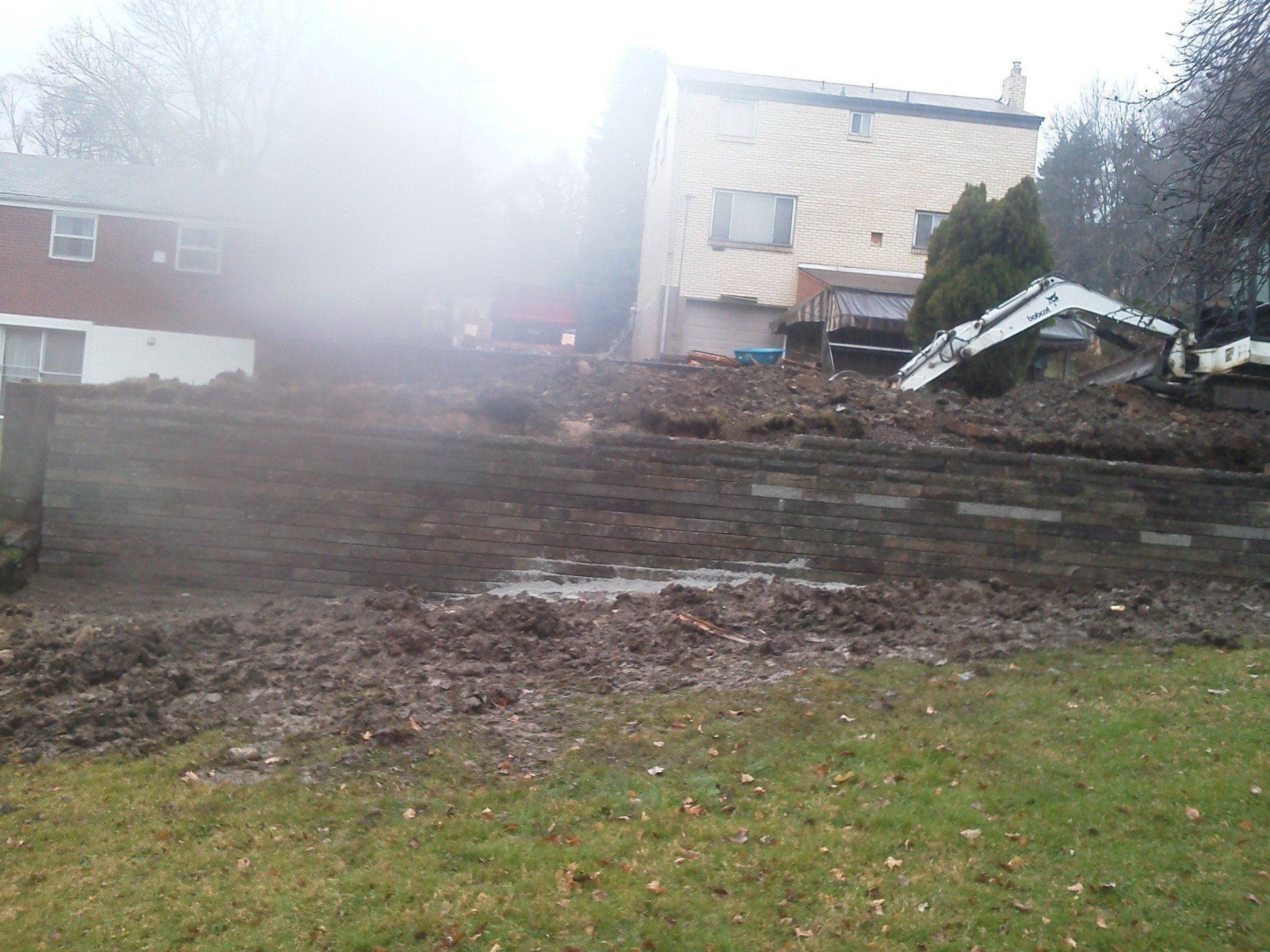 A house with a lot of dirt in front of it