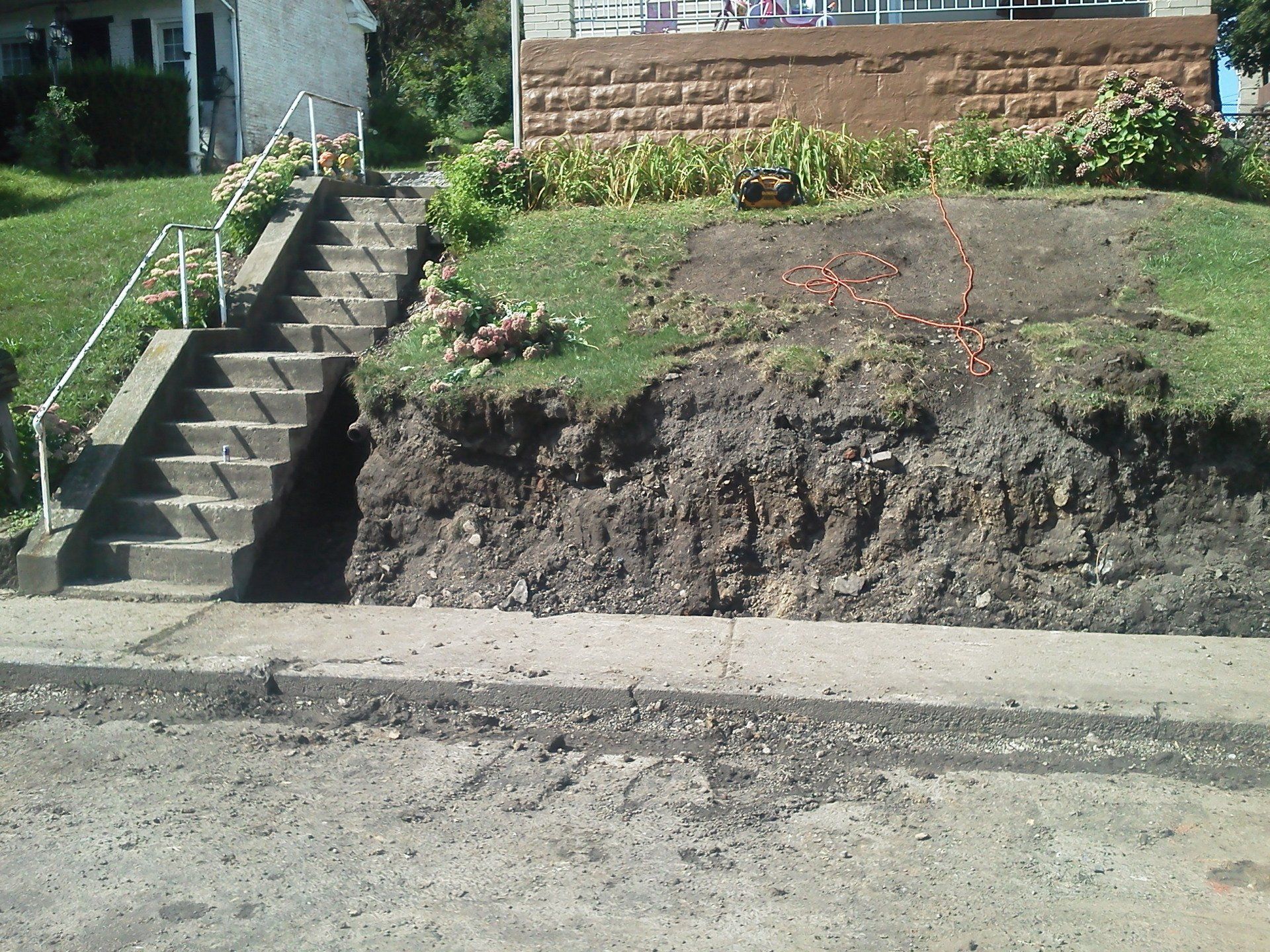 A concrete staircase leading up to a house