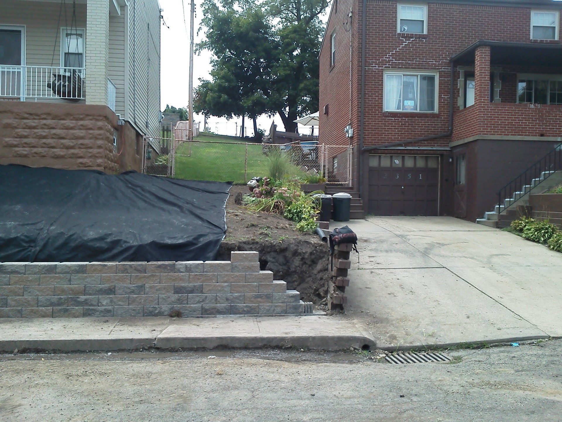A brick house with stairs leading up to it