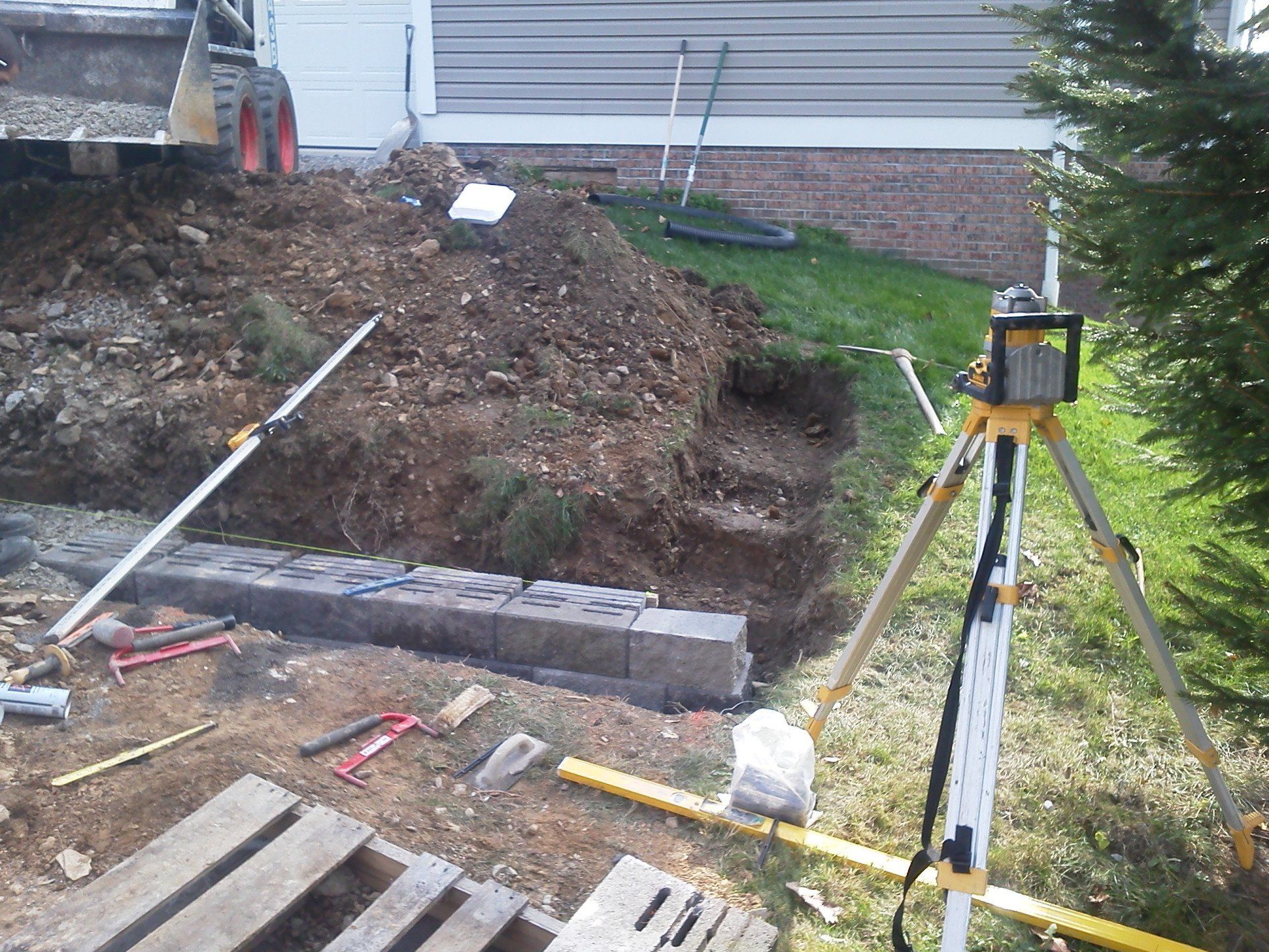 A construction site with a tripod in the foreground