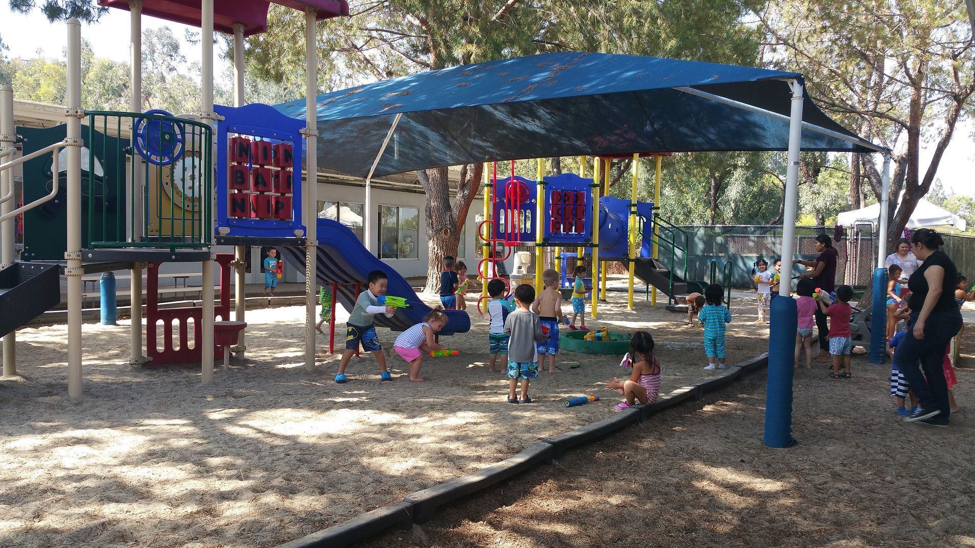 A Group of Children Are Playing in A Playground — Placentia, CA — Towne and Country