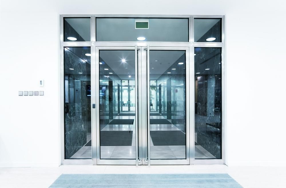 Large Glass Door in a Building With a Lot of Windows — G & A Glass & Aluminium in Whitsundays, QLD
