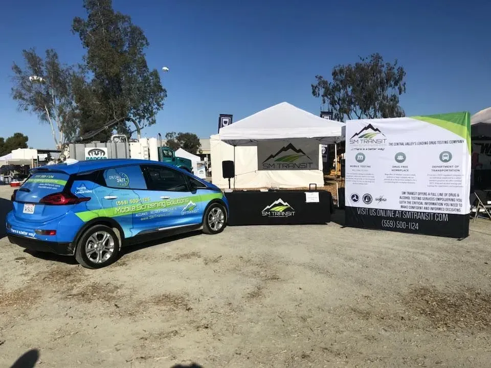 Three women wearing face masks are posing for a picture.