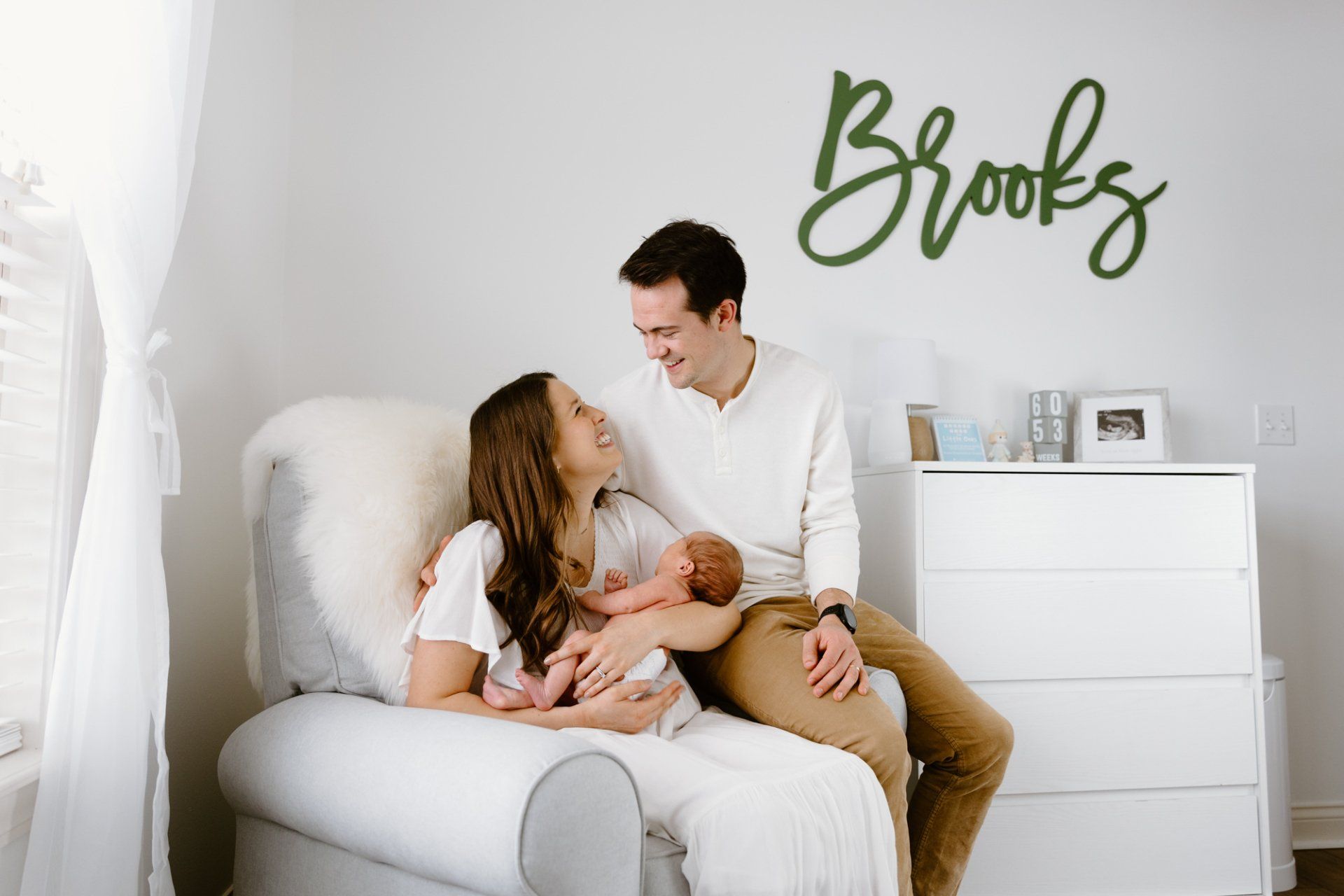 Mom and dad hold their baby