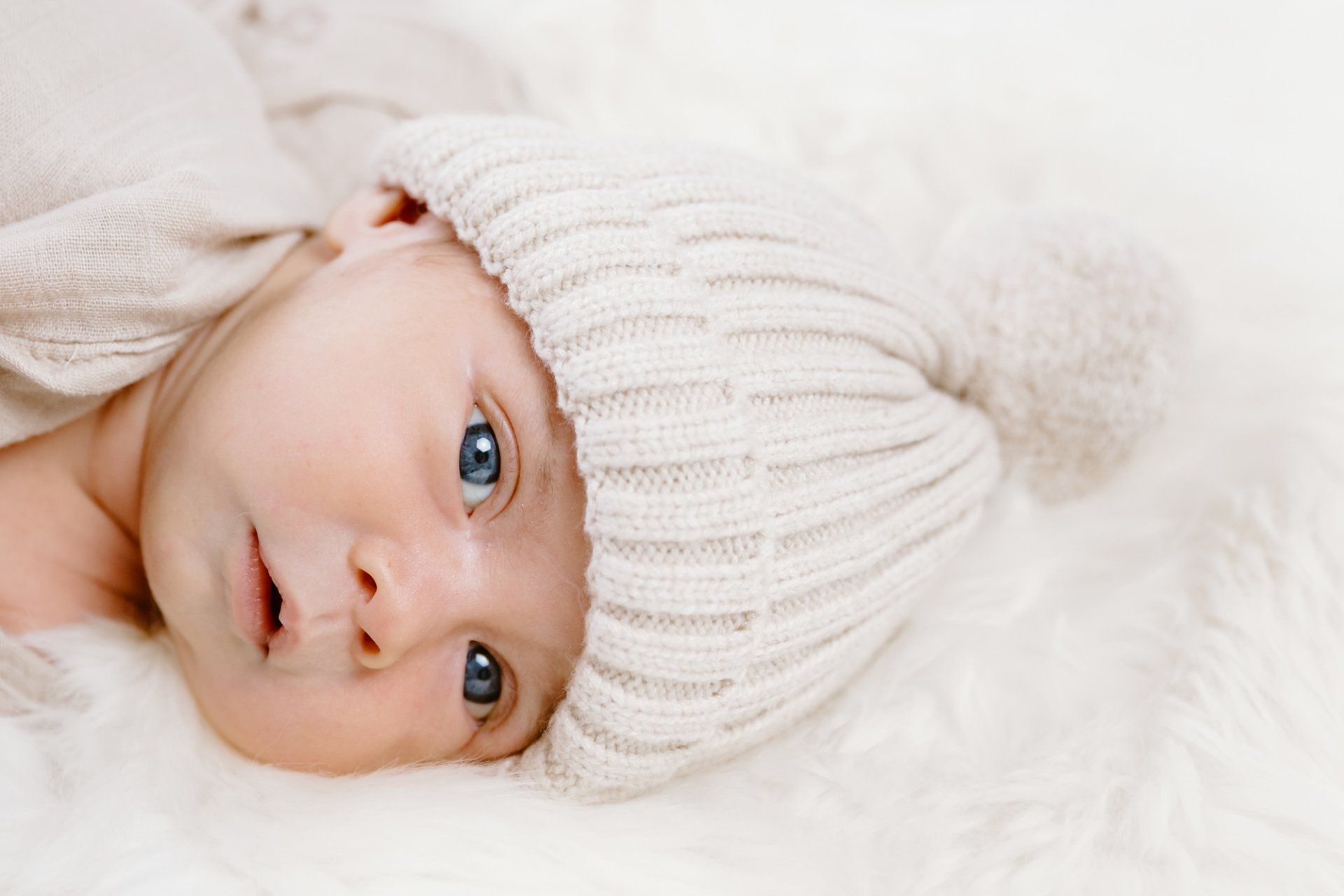 Newborn baby boy with a hat on