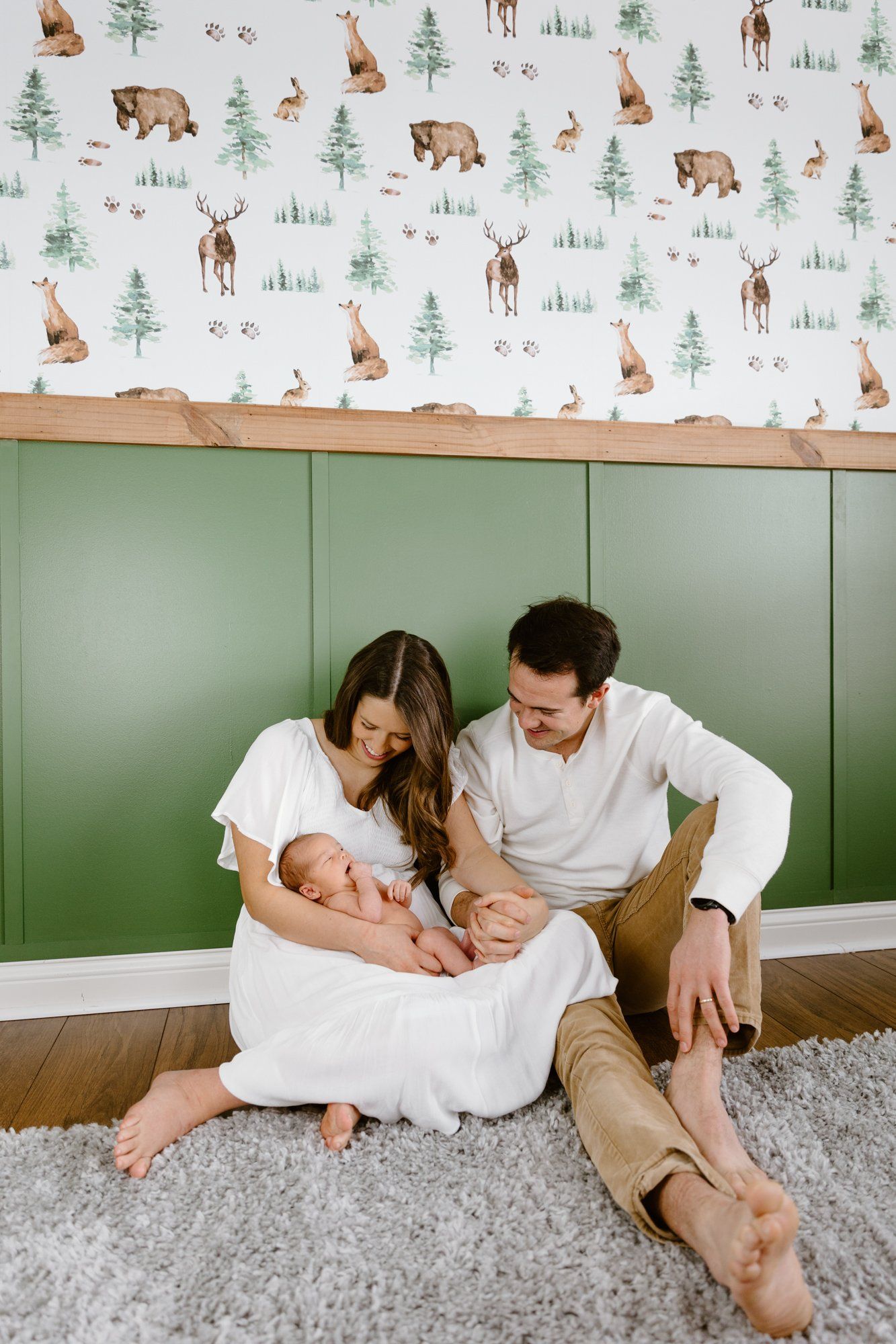 Mom and dad hold their baby boy