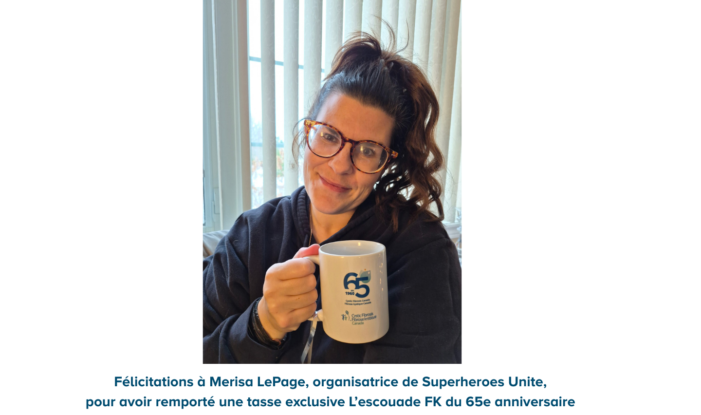 Event organizers holding 65th anniversary mug and thank you card.