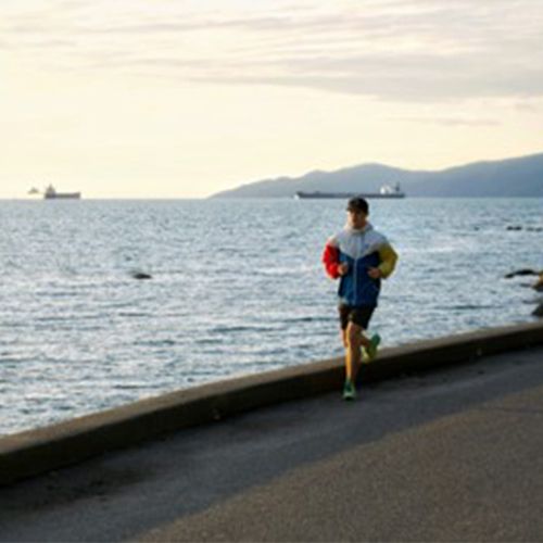 Darren running along the waterfront