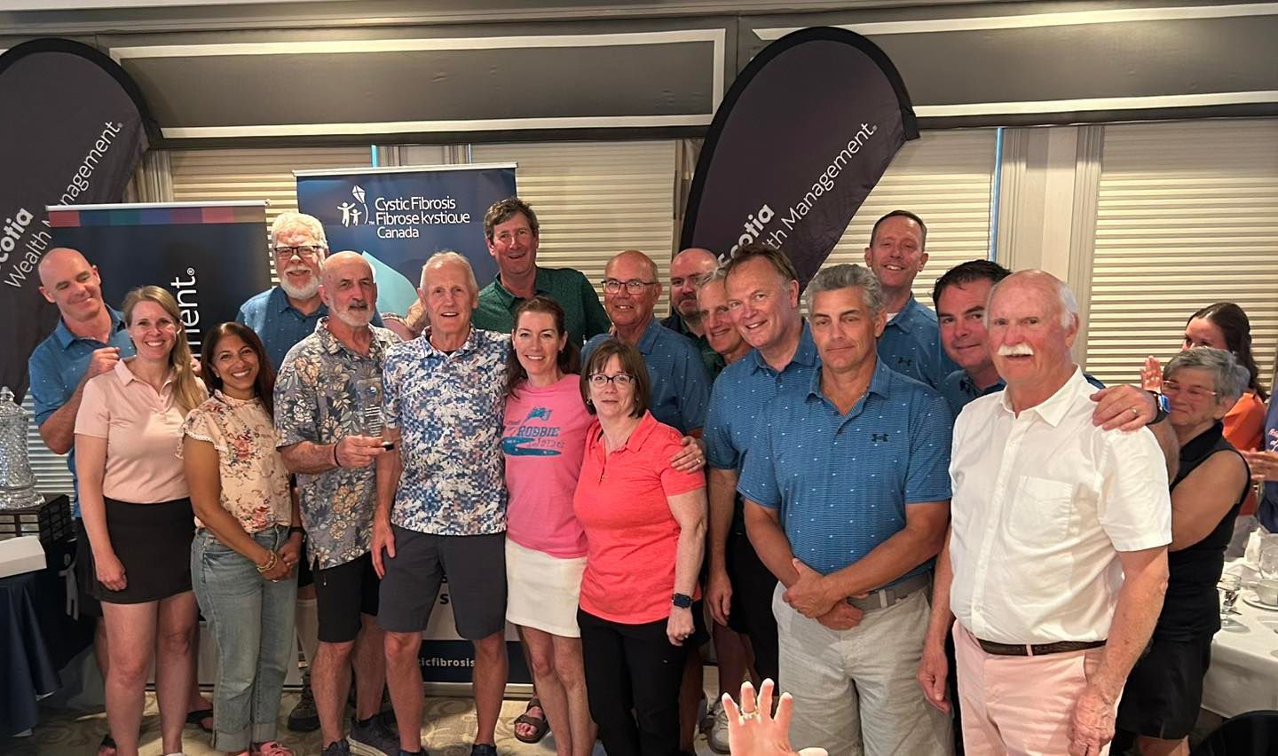 Committee members at the Gallivan Golf Tournament holding their 65th Anniversary Plaque.