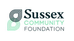 Logo of Sussex Community Foundation; teal and dark green teardrop design with text.