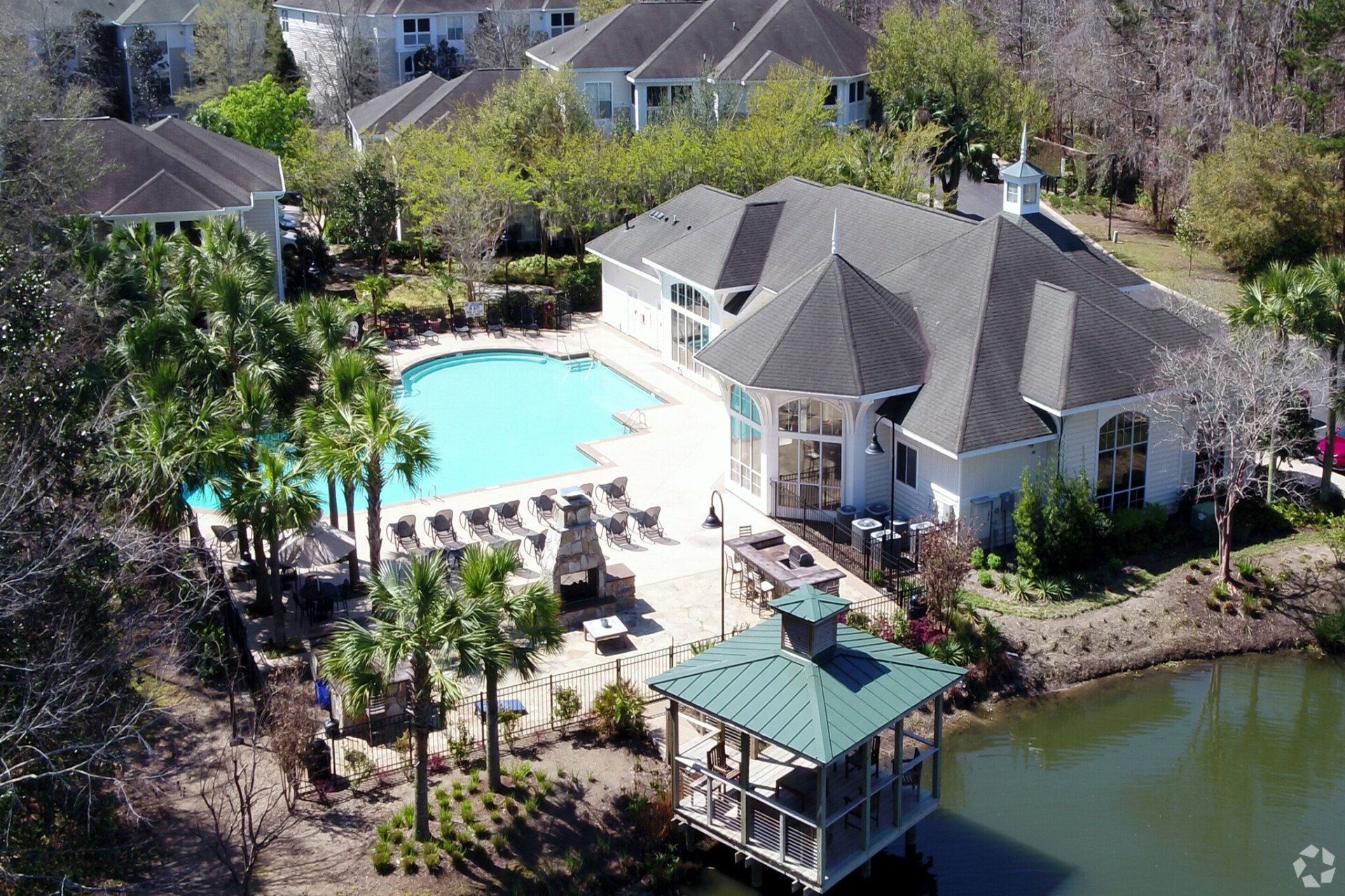 An aerial view of a house with a swimming pool