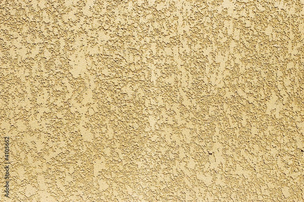 A close up of a sandy surface with a grainy texture.