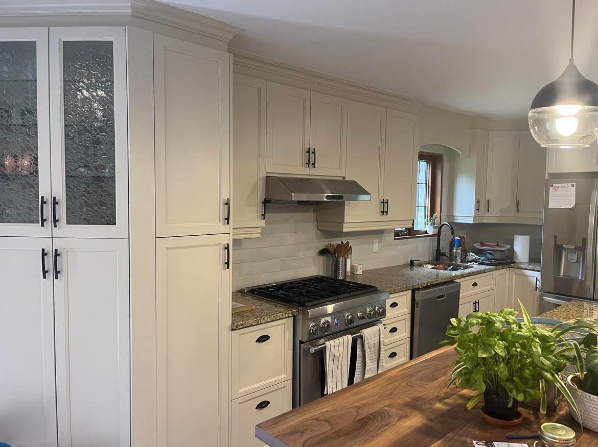 A before and after photo of a kitchen with white cabinets and stainless steel appliances.