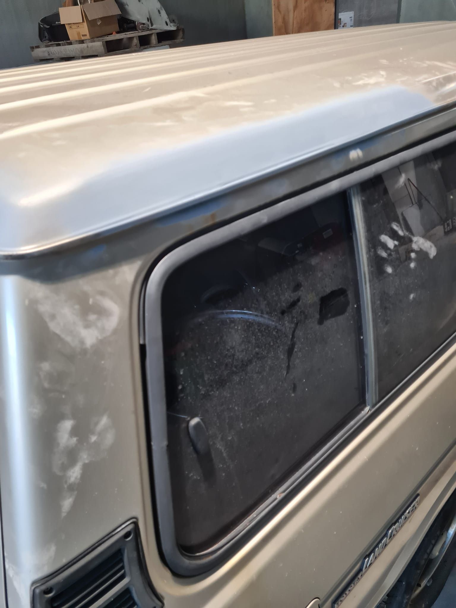 Close-up of a Beige Truck Camper Side Window — A2B Smash Repairs in Berkeley Vale, NSW