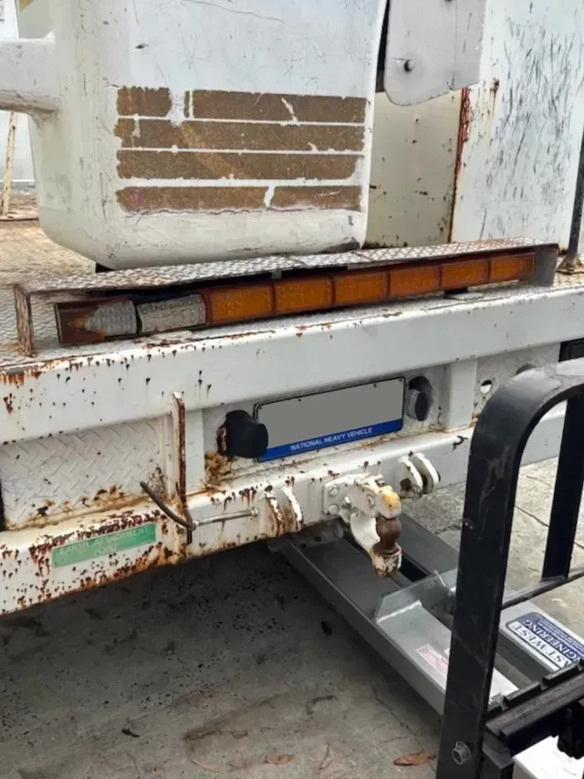 Close-up of a Dirty White Truck Rear With Rust — A2B Smash Repairs in Berkeley Vale, NSW