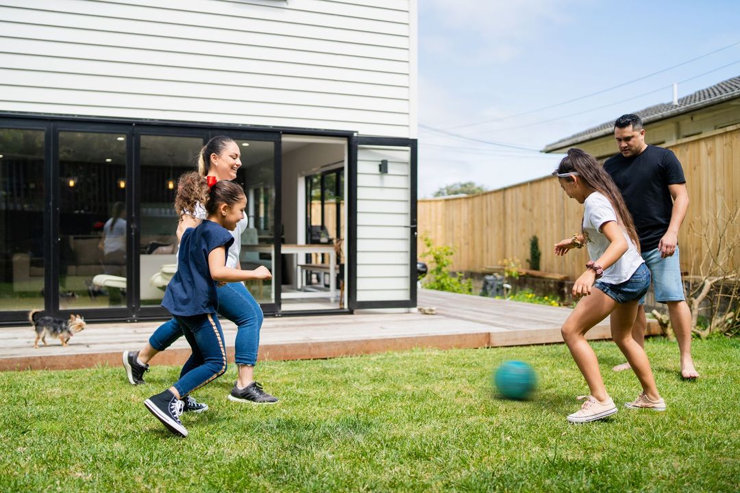 Family Playing On Their Backyard — Christchurch, NZ — Money For You Mortgages